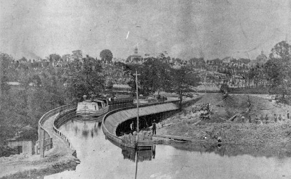 Historic photo of a wooden aqueduct over Mitchell Avenue on the Miami & Erie Canal