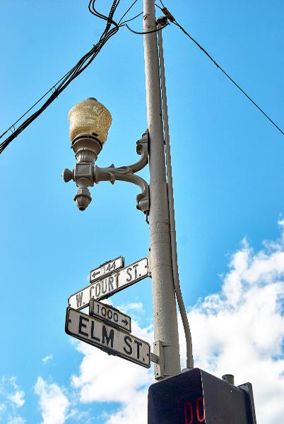 Close-up view of the old signs and street light from the last photo