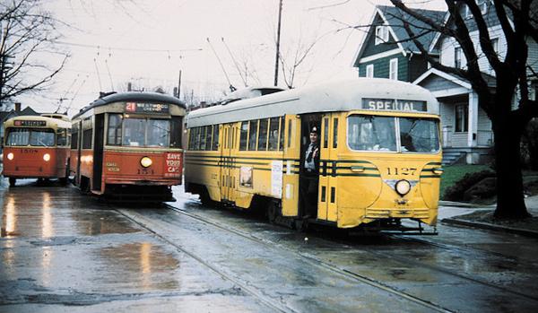 A special railfan trip featuring a newer yellow PCC streetcar on Montana Avenue at the end of the 21 Westwood Cheviot line