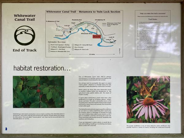 Whitewater Canal and railroad informational board near where the railroad tracks start