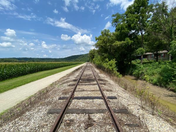 Whitewater Valley Railroad on the canal towpath with the mostly empty canal on the right