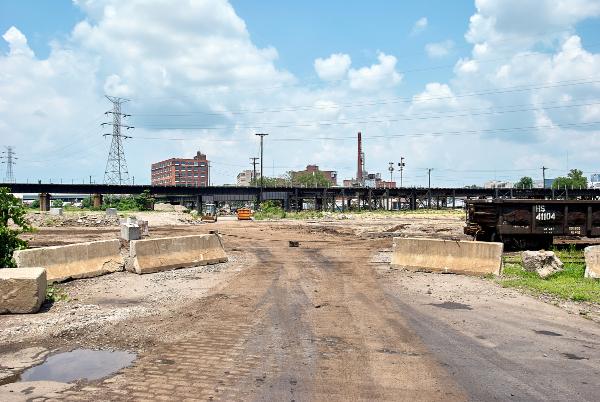 Tracks crossing an abandoned stretch of Baymiller Street