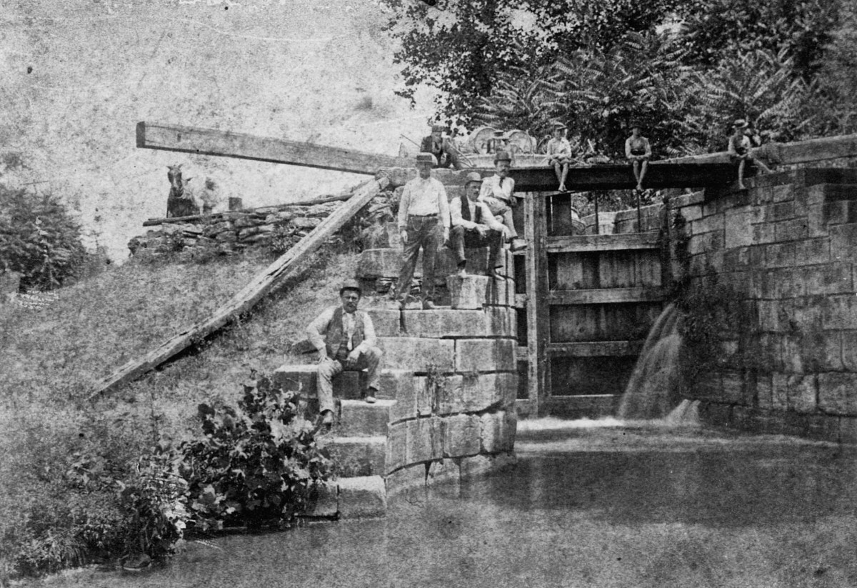 The Excello lock was the first constructed on the Miami & Erie Canal. Note the large stone blocks and the wooden gate holding back the water.
