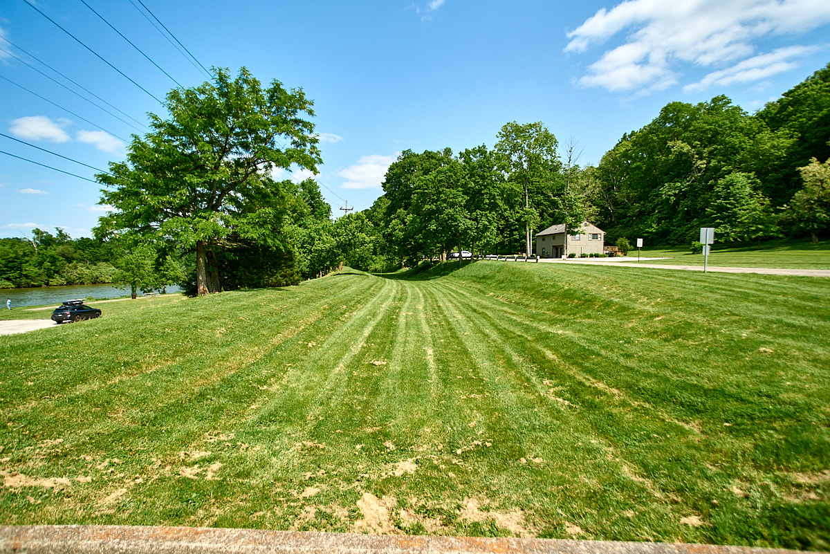 A typical view of the remains of the Miami & Erie Canal in rural areas. A drained channel that is often overgrown and forgotten, but obvious to those who know what to look for.