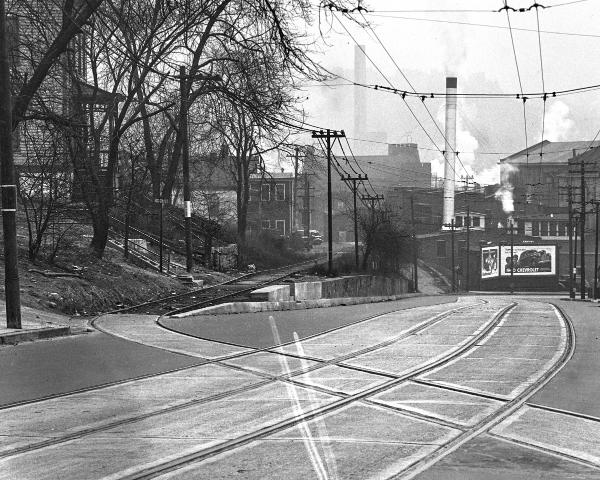 Close-up of the previous photo of the Cincinnati & Westwood tracks crossing Harrison Avenue in South Fairmount after repaving