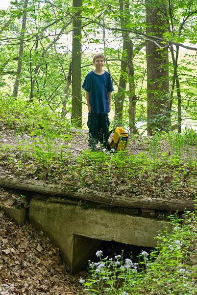 Tyler is posing from atop the culvert from the last two photos