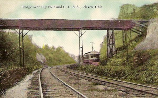 Historic postcard of a CL&A car sharing the cut through North Bend Hill with the Big Four Railroad