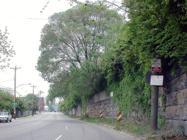 Massive stone retaining walls for the Indiana & Ohio Oasis, former Pennsylvania/Little Miami Railroad along Eastern Avenue/Riverside Drive in Pendleton