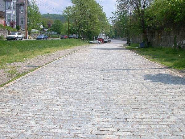Old granite block paved roadway between the Indiana & Ohio Oasis, former Pennsylvania/Little Miami Railroad line and Walworth Avenue in Columbia-Tusculum