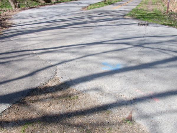Tracks showing through pavement at Connes Road north of downtown Loveland