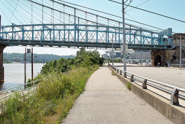 View of the Waterfront Belt Line ROW along Mehring Way, passing under the Roebling Suspension Bridge