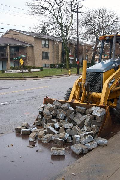 Utility work unearths granite paving on Madison Road in Hyde Park