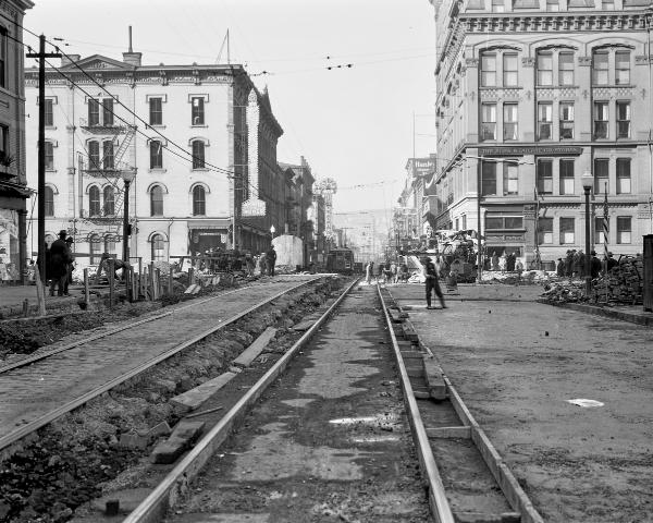 Historic photo of streetcar and road reconstruction at Main and Central Parkway in 1926