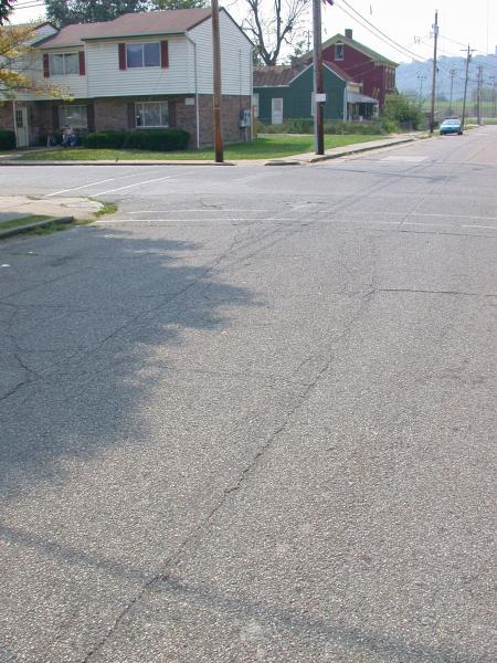 Cracks in the street reveal buried tracks at 3rd Avenue and Clay Street in Dayton