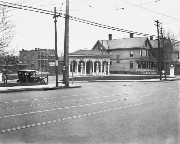 Historic photo of streetcar tracks and an old Standard Oil gas station on Reading Road at Lincoln Avenue in Avondale